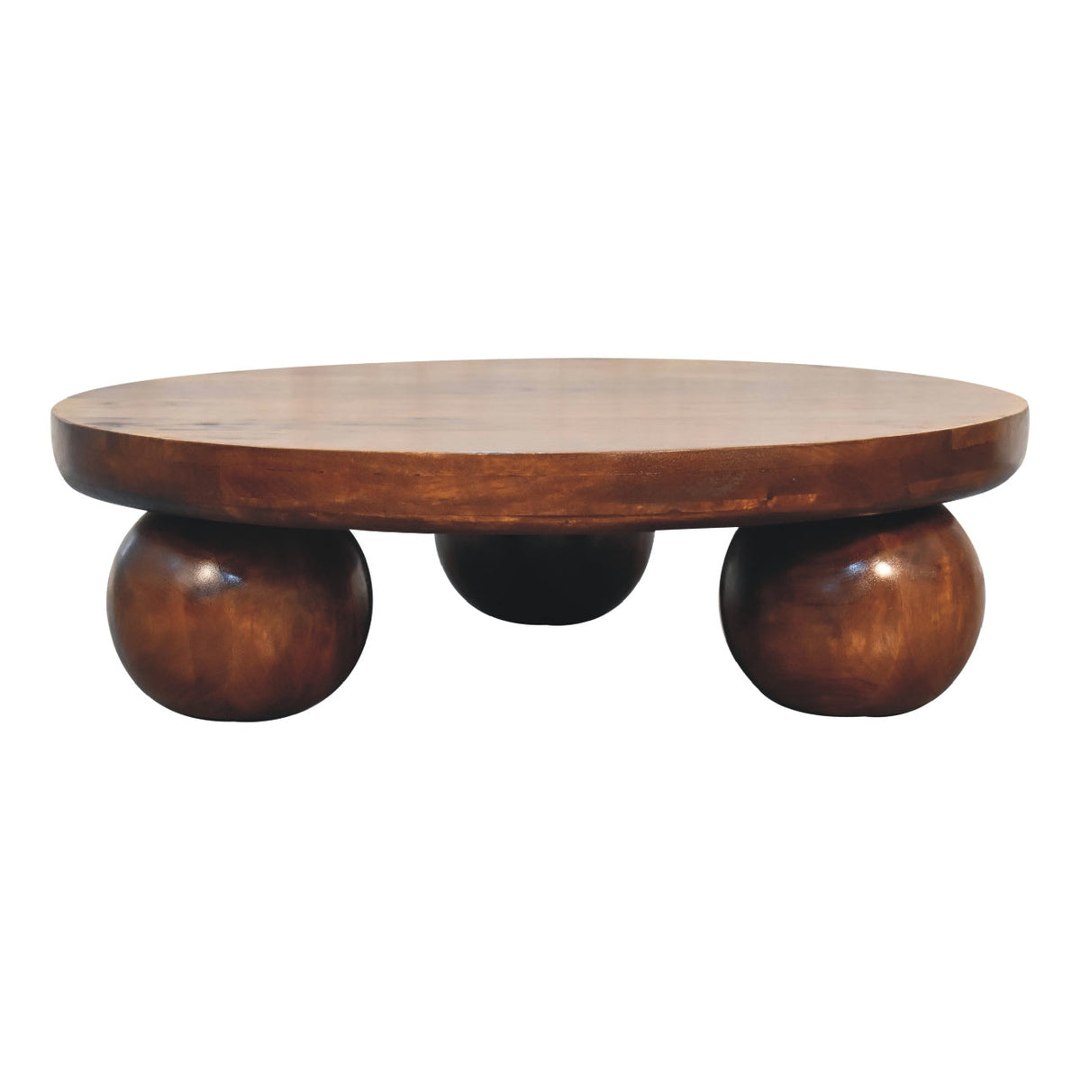 Chestnut Ball Coffee Table styled with books and decor on top