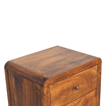 Detail view of the Chestnut Curved Storage Cabinet's solid mango wood grain