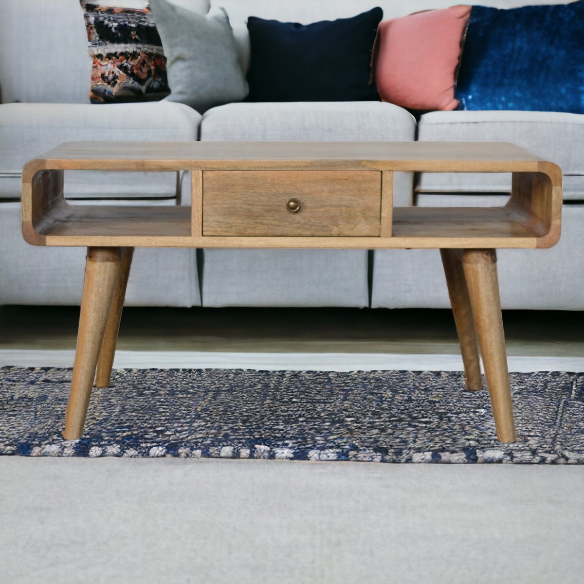 Curved Open Coffee Table in oak-ish finish, front view showing two drawers and open display shelf