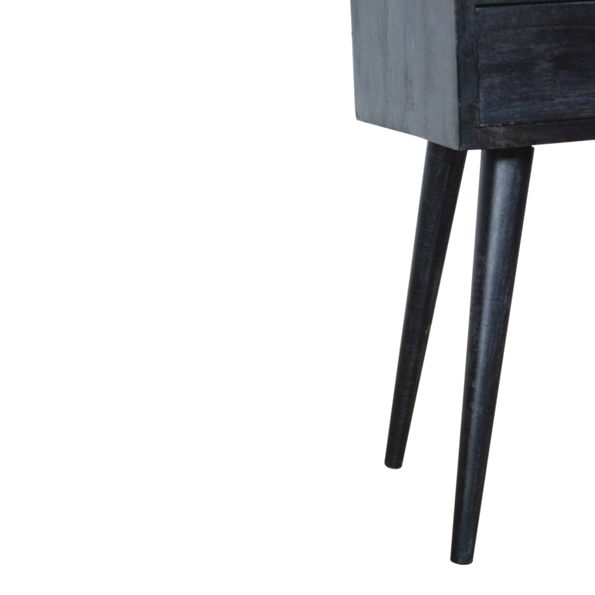 Detail view of the Ash Black Mini Bedside Table's open shelf