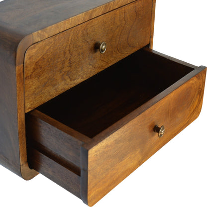 Floating Curved Bedside Shelf styled with a lamp and decor